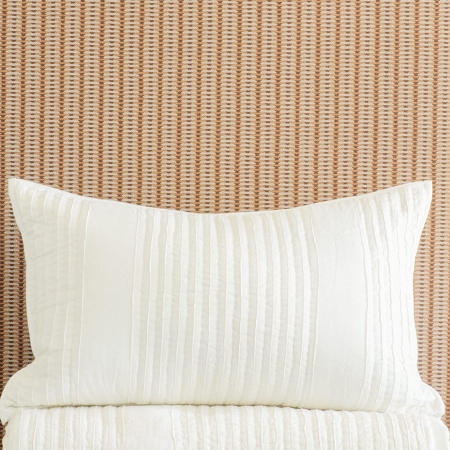 Puritsu ivory bedspread and pillowsham stack