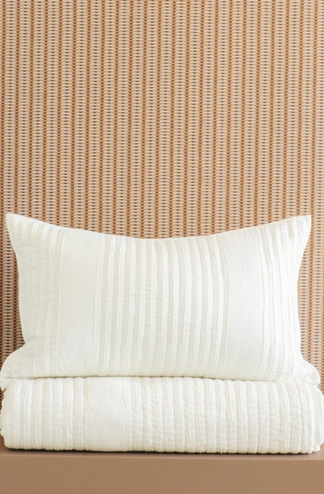 Puritsu ivory bedspread and pillowsham stack
